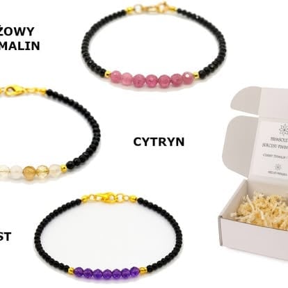 Three beaded bracelets with black beads and colored gemstones, displayed with product packaging labeled Cytryn